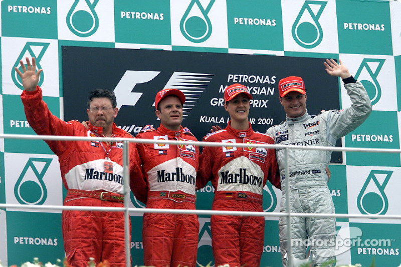 Ross Brawn, Rubens Barrichello, Michael Schumacher et David Coulthard sur le podium