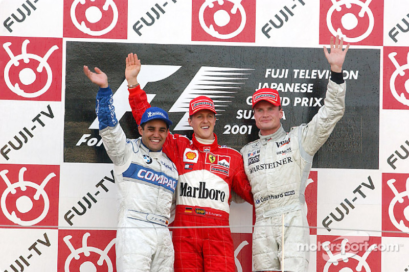 The podium: race winner Michael Schumacher with Juan Pablo Montoya and David Coulthard