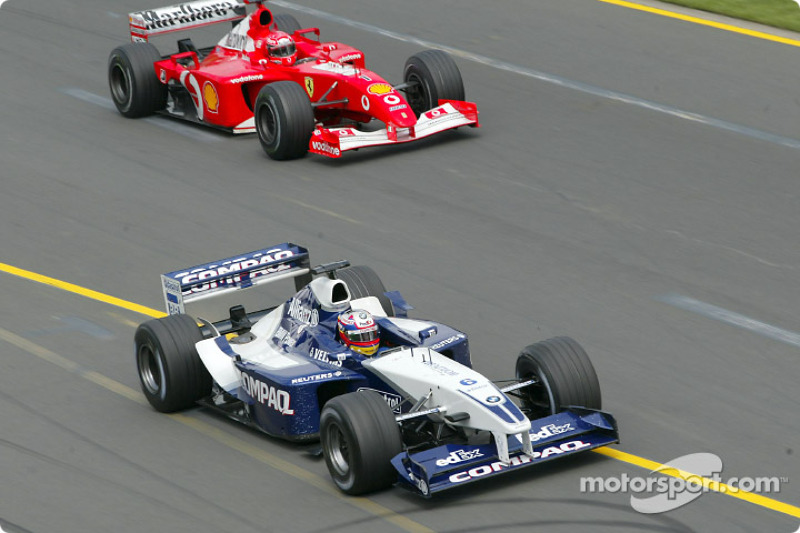 Juan Pablo Montoya leading Michael Schumacher