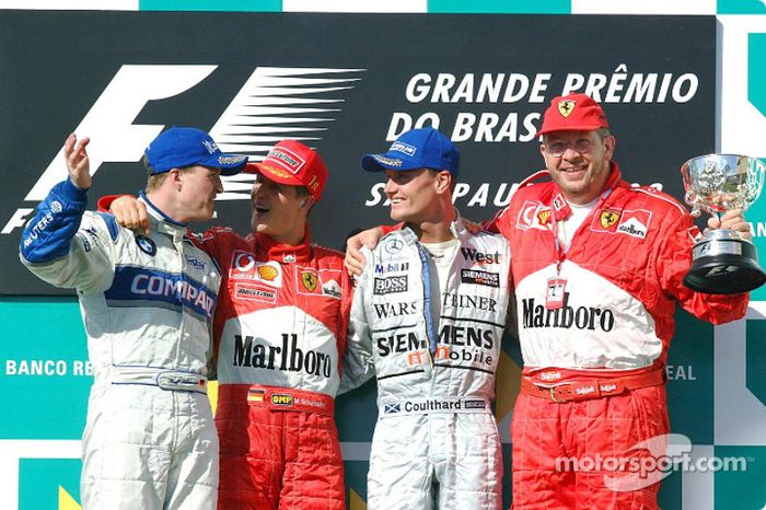 The podium: race winner Michael Schumacher with Ralf Schumacher, David Coulthard and Ross Brawn