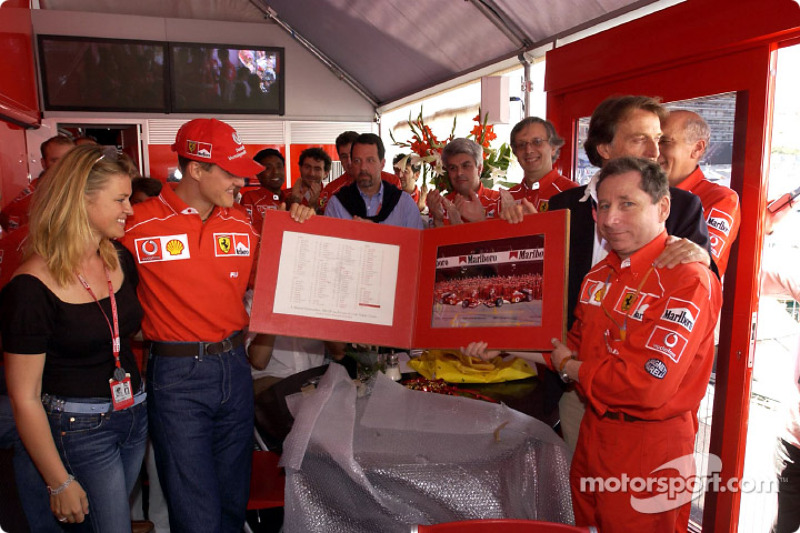 Michael Schumacher celebrating his 100th Grand Prix with Ferrari