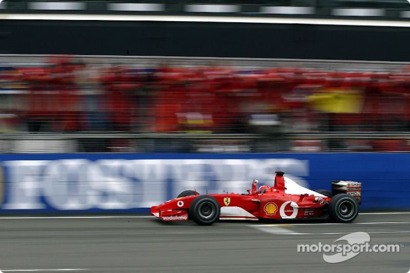 Michael Schumacher taking the checkered flag