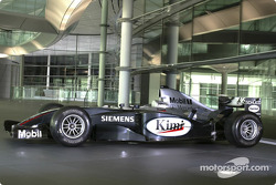 Team McLaren Mercedes Formula One car in front of the Schüco manufactured facade at the McLaren Technology Centre