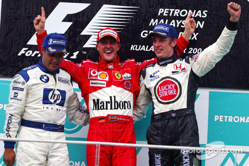 Podium: race winner Michael Schumacher with Juan Pablo Montoya and Jenson Button