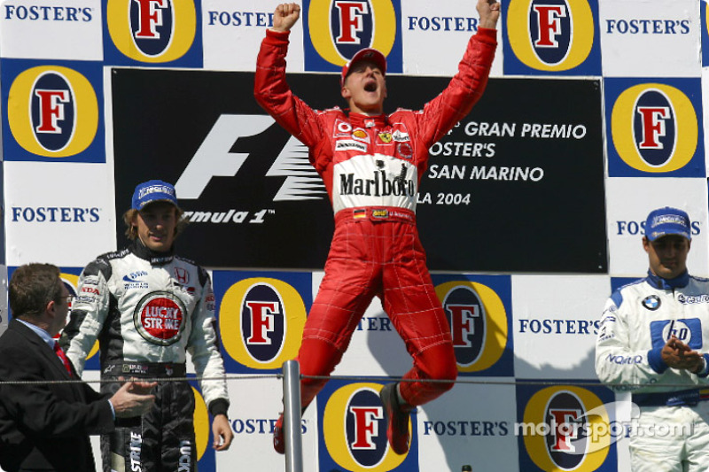 Podium: race winner Michael Schumacher with Jenson Button and Juan Pablo Montoya