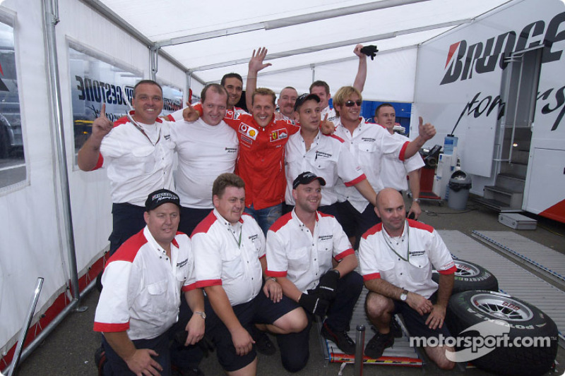 Michael Schumacher celebrates 7th World Championship with Bridgestone team members