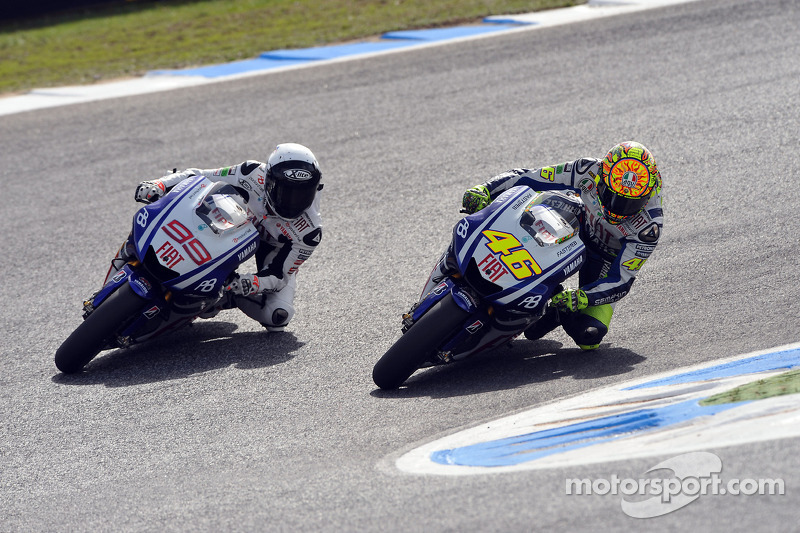 Jorge Lorenzo, Fiat Yamaha Team passes Valentino Rossi, Fiat Yamaha Team for the lead