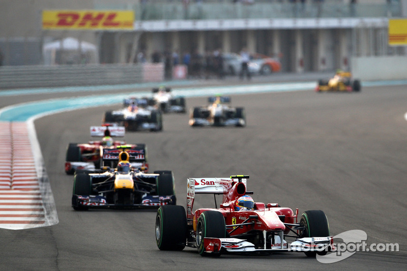 Fernando Alonso, Scuderia Ferrari leads Mark Webber, Red Bull Racing