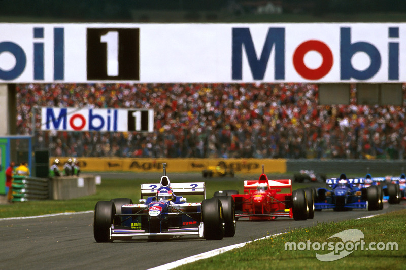 Jacques Villeneuve, Williams FW19 Renault; Michael Schumacher, Ferrari F310B; Olivier Panis, Prost JS45 Mugen Honda