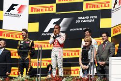 The podium, Romain Grosjean, Lotus F1 Team, second; Lewis Hamilton, McLaren Mercedes, race winner; Sergio Perez, Sauber, third