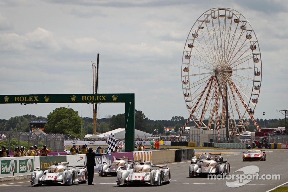 #1 Audi Sport Team Joest Audi R18 E-Tron Quattro: Marcel Fässler, Andre Lotterer, Benoit Tréluyer takes the checkered flag in front of #2 Audi Sport Team Joest Audi R18 E-Tron Quattro: Rinaldo Capello, Tom Kristensen, Allan McNish