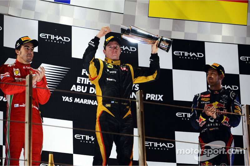 The podium: second place Fernando Alonso, Ferrari, race winner Kimi Raikkonen, Lotus F1 Team, third 