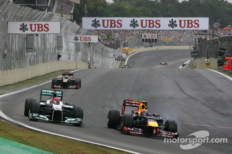 Michael Schumacher, Mercedes GP, y Mark Webber, Red Bull Racing