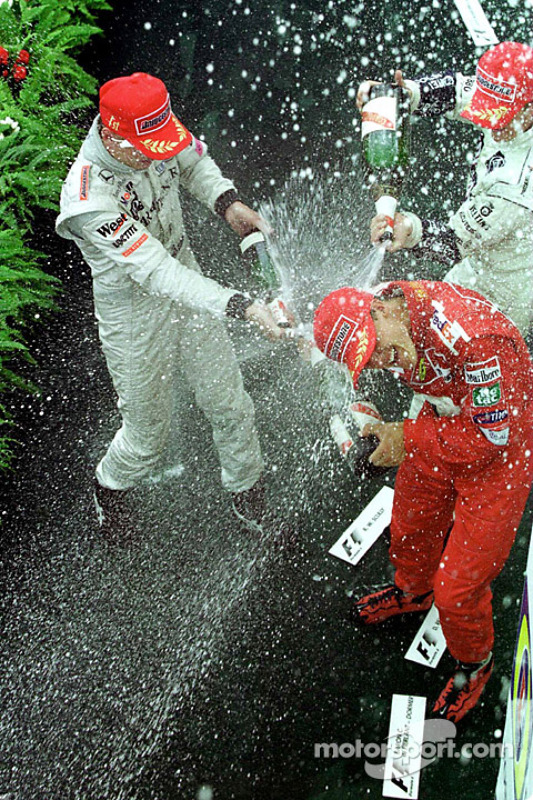 Podium: race winner Mika Hakkinen, second place Michael Schumacher, third place Ralf Schumacher