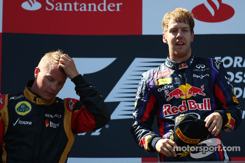 2nd place Kimi Raikkonen, Lotus F1 Team  with 1st place Sebastian Vettel, Red Bull Racing