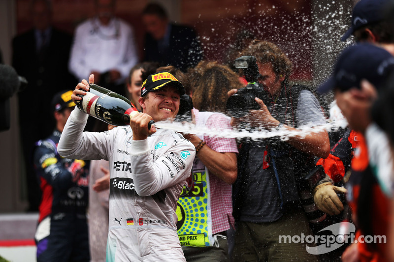 Race winner Nico Rosberg, Mercedes AMG F1 celebrates with the champagne at the podium