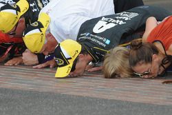 Race winner Jeff Gordon kisses the yard of Bricks