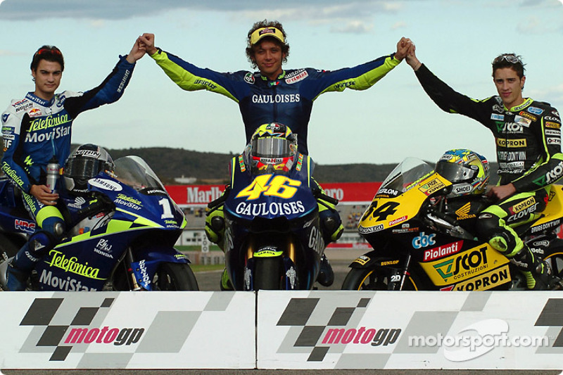 The 2004 champions: MotoGP 500cc champion Valentino Rossi, with 250cc champion Daniel Pedrosa and 125cc champion Andrea Dovizioso