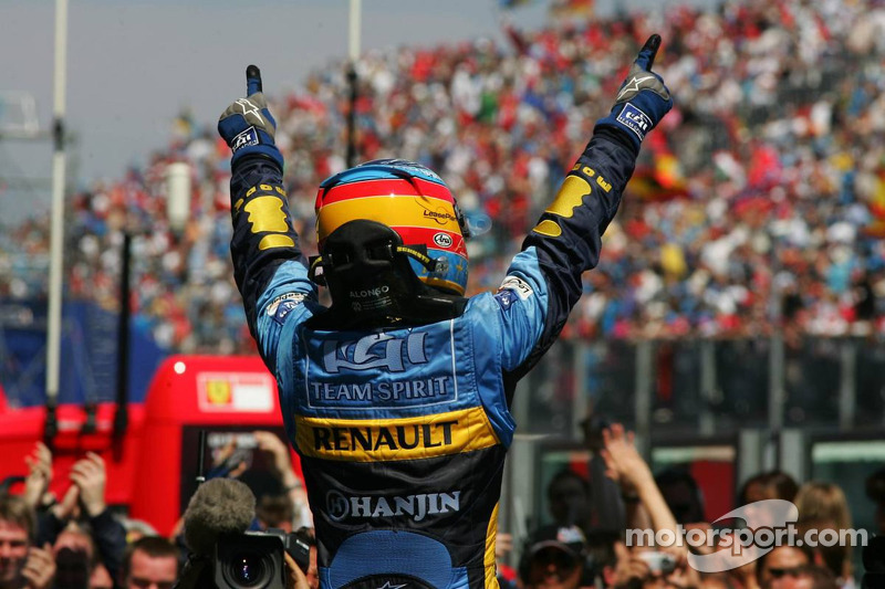 Race winner Fernando Alonso celebrates