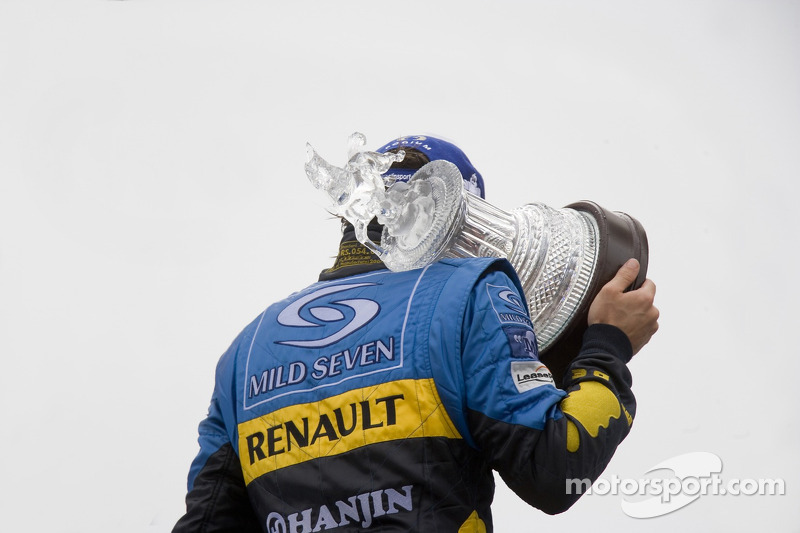 Podium: race winner Fernando Alonso celebrates