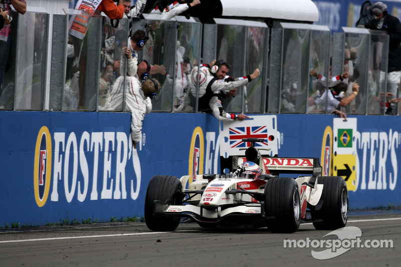 Race winner Jenson Button celebrates