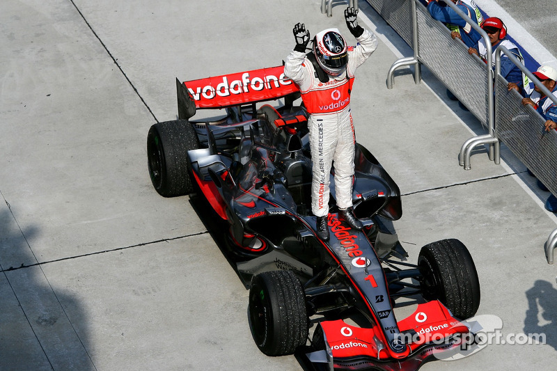 Race winner Fernando Alonso celebrates