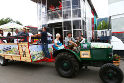 A local Spielberg tractor, pulls up outside the Manor F1 Team моторхоум