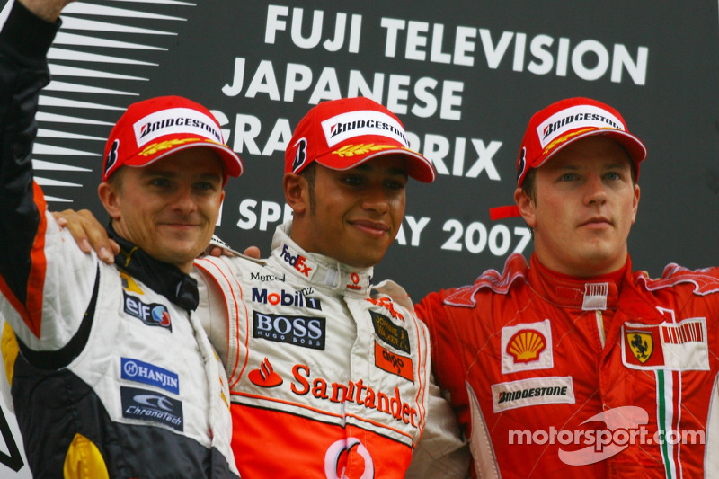 Podium: race winner Lewis Hamilton with Heikki Kovalainen and Kimi Raikkonen