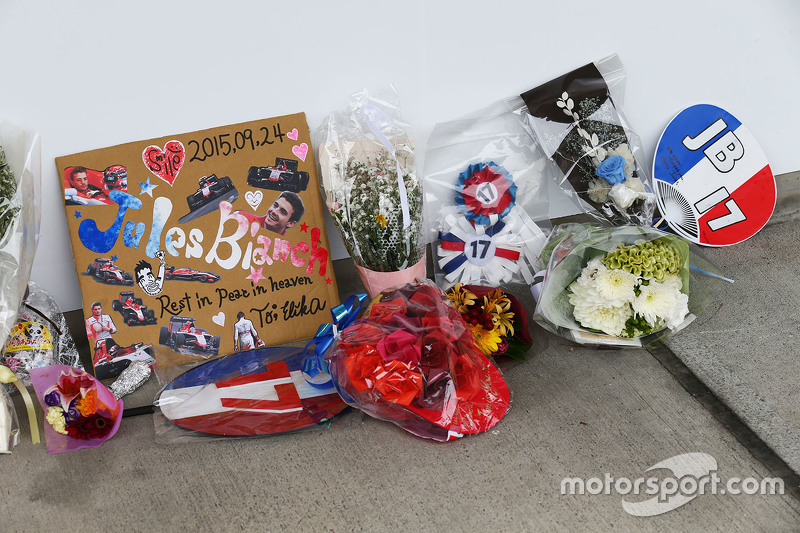 Tributes to Jules Bianchi are placed beside the Manor Marussia F1 Team pit garage