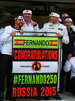 (L to R): Fernando Alonso, McLaren celebrates his 250th GP with Eric Boullier, McLaren Racing Director, Jenson Button, McLaren, and the team