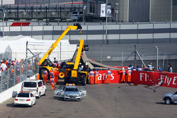 Carlos Sainz Jr., Scuderia Toro Rosso STR10 is extracted from the barriers after he crashed in the third practice session