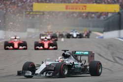 Lewis Hamilton, Mercedes AMG F1 W06 leads the battling Sebastian Vettel, Ferrari SF15-T and Kimi Raikkonen, Ferrari SF15-T