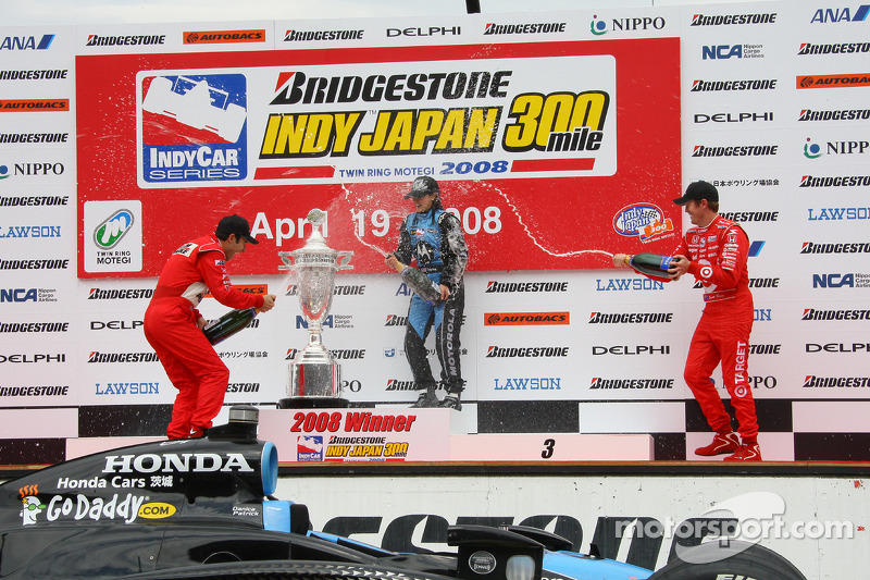 Podium: race winner Danica Patrick celebrates with Helio Castroneves and Scott Dixon