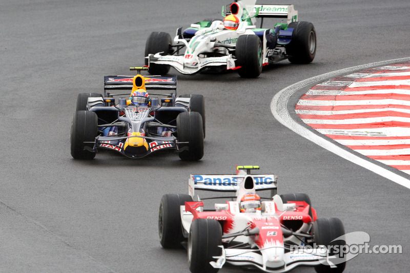 Timo Glock, Mark Webber y Rubens Barrichello