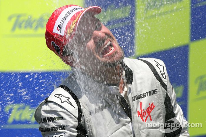 Podium: champagne celebration for race winner Rubens Barrichello